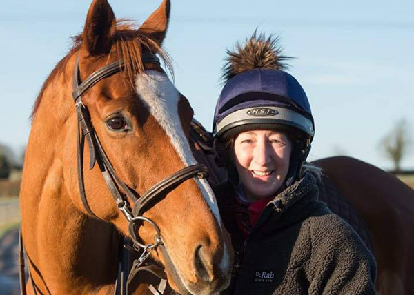 Rider posing with their horse